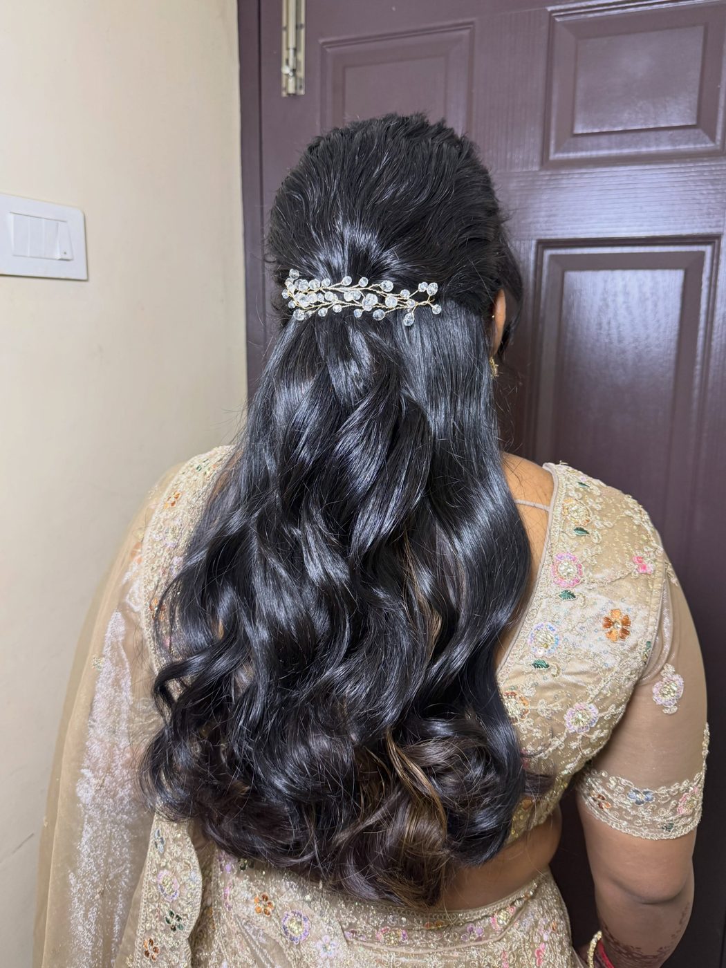 Voluminous curls with pearl hair accessory