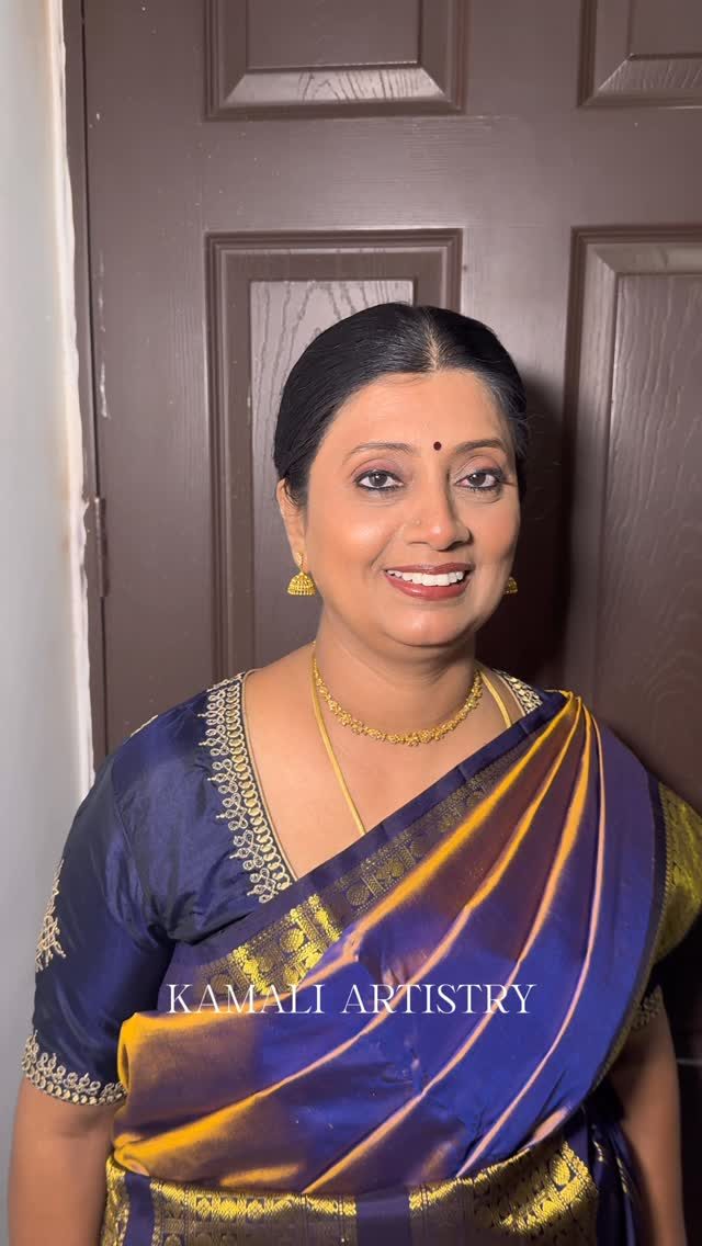 Smiling client in blue and gold silk