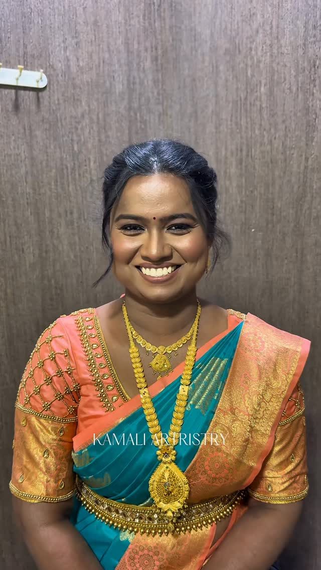 Smiling bride in orange and gold silk
