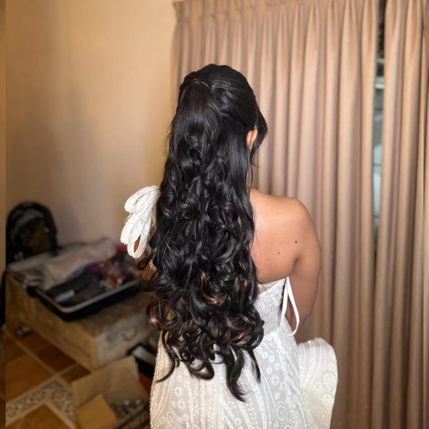 Long curls for a white gown