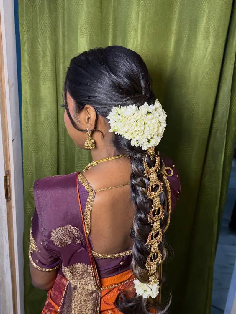Long braid with jasmine flowers and gold hair jewellery, bridal hairstyle in Chennai