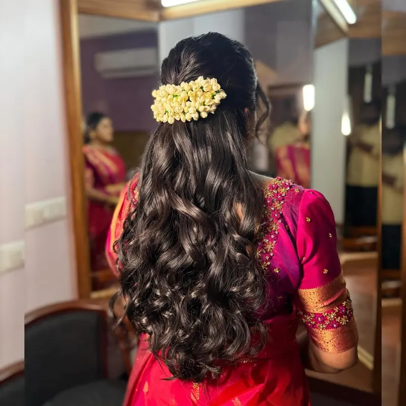 Soft curls with golden hair flowers, back view
