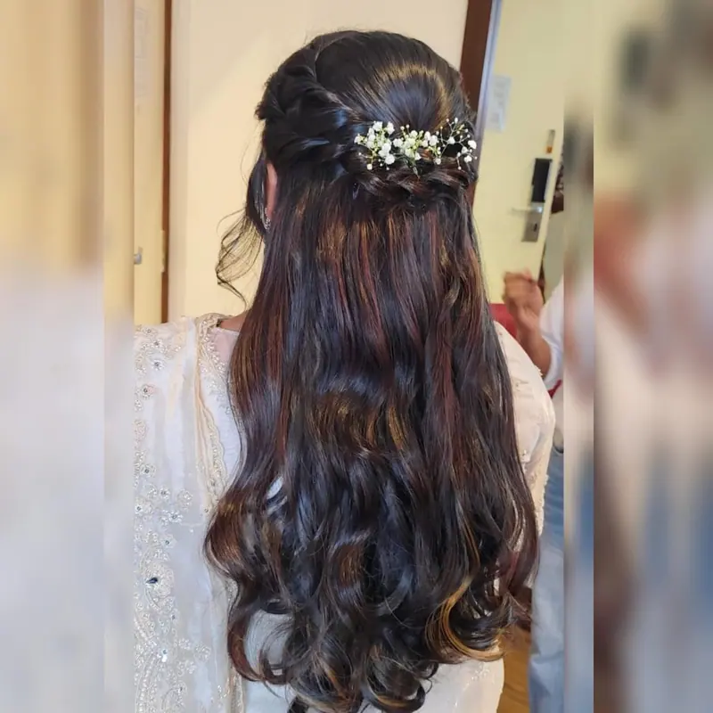 Half-up soft waves with small floral pins, back view